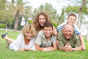 7623670-multi-generation-family-enjoying-sunny-day-in-park-and-having-fun-stock-photo